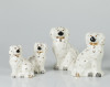 Dos parejas de perros, de loza manufactura Beswick, Staffor