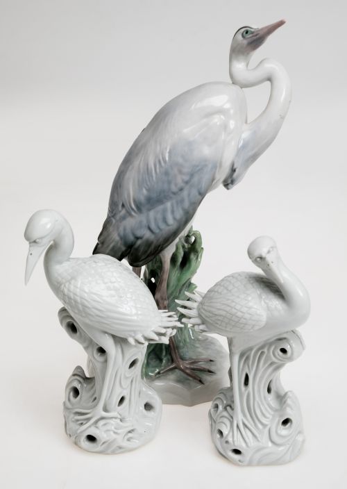 "Herons", a pair of enameled white porcelain figures follow