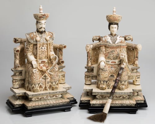 "Emperor" and "Empress" pair of carved and inked bone sculp