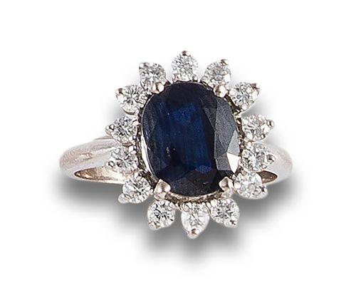 DIAMOND AND CENTRAL SAPPHIRE ROSETTE RING, IN WHITE GOLD