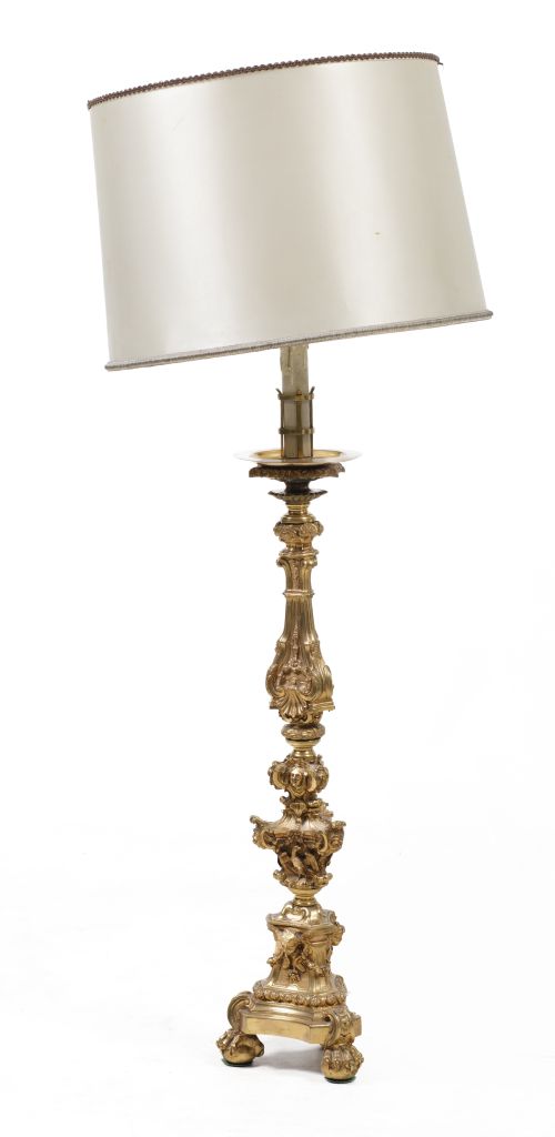 Table lamp made from a gilded bronze axe, following models