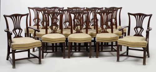 Twelve chairs and two armchairs in mahogany in Chippendale