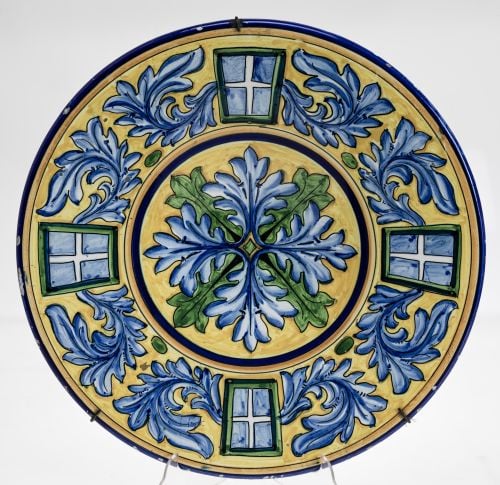 Ceramic plate glazed in polychrome following Italian models