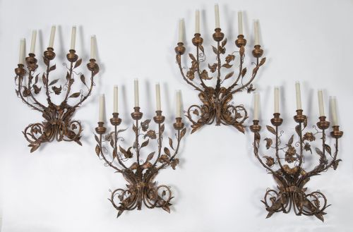 Four patinated metal wall lights, 20th century