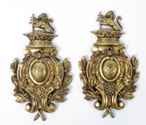 Pair of decorative elements in gilded metal, early 20th cen